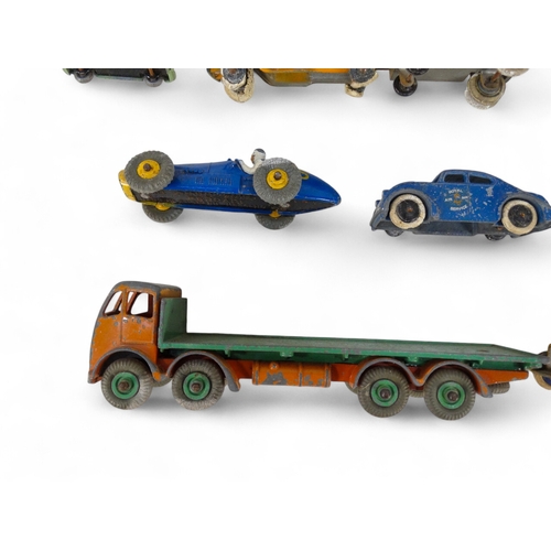 516 - A small quantity of Dinky vehicles - including a Foden flat-bed truck, Ferrari racer and a fire engi... 