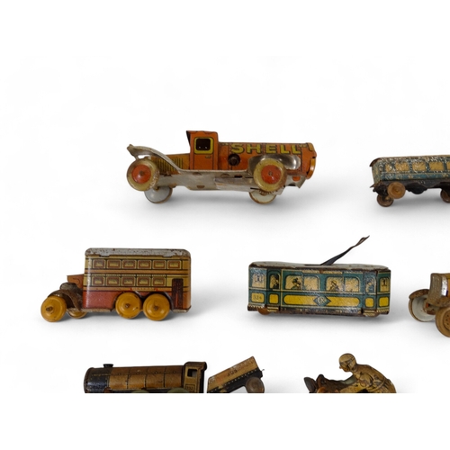 517 - A small quantity of early 20th century German tin plate clockwork toys - with lithographic decoratio... 