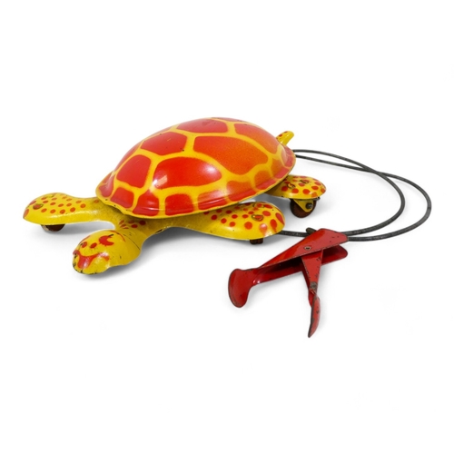 520 - A vintage Mobo tinplate tortoise - decorated in yellow and red, 29cm wide, together with a tinplate ... 