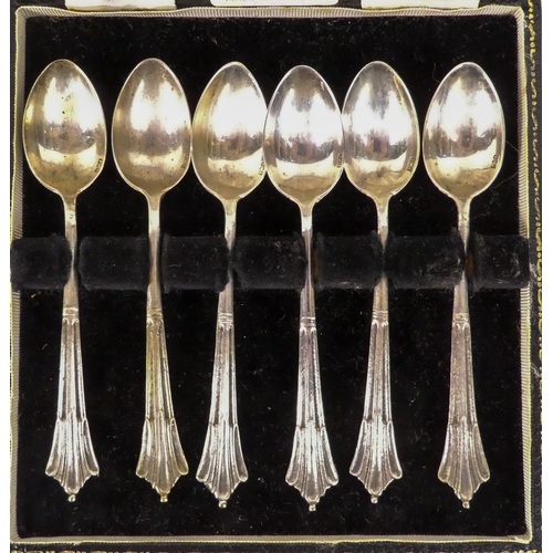 523 - A boxed set of continental white metal tea spoons - stamped 800, together with a pair of silver crue... 