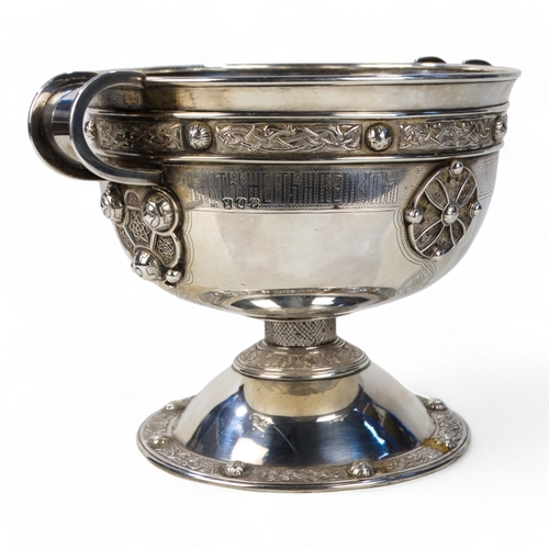 527 - A large Britannia silver bowl - Dublin 1930, with twin handles and Celtic strapwork decoration, rais... 