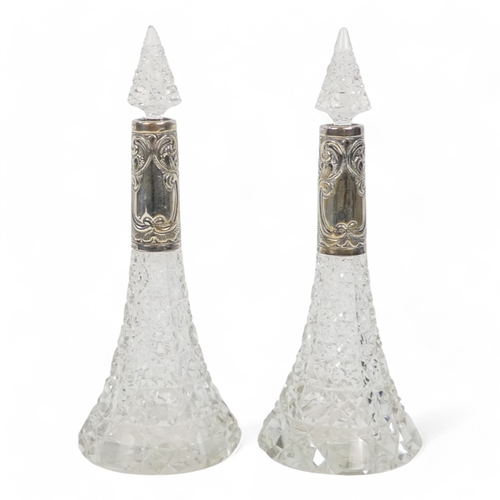 536 - A pair of clear cut glass and silver mounted perfume bottles - Birmingham 1903, of trumpet form with... 