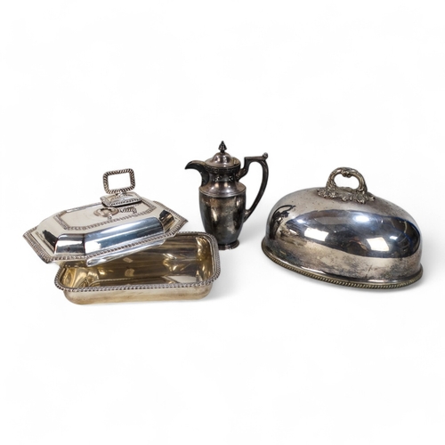 581 - A small quantity of silver plated ware - including an oval domed cloche, a hot water jug, an entree ... 