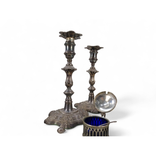 583 - A pair of George II style silver plated candlesticks - of decorative baluster form, together with fo... 