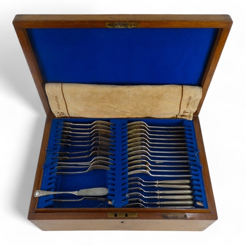 584 - A 20th century oak canteen of plated cutlery - mixed service of sundry items, the case fitted with b... 