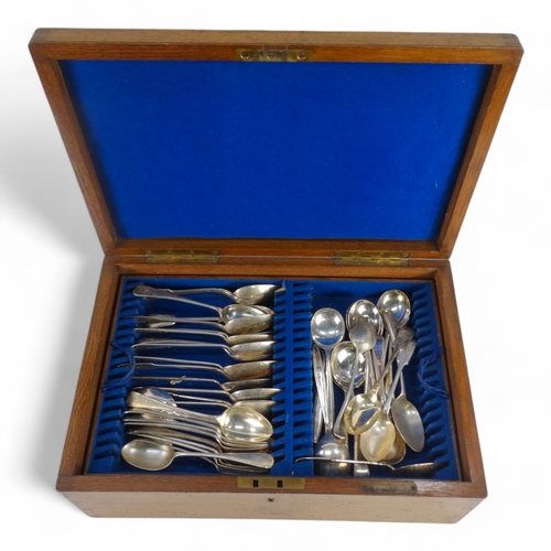 584 - A 20th century oak canteen of plated cutlery - mixed service of sundry items, the case fitted with b... 