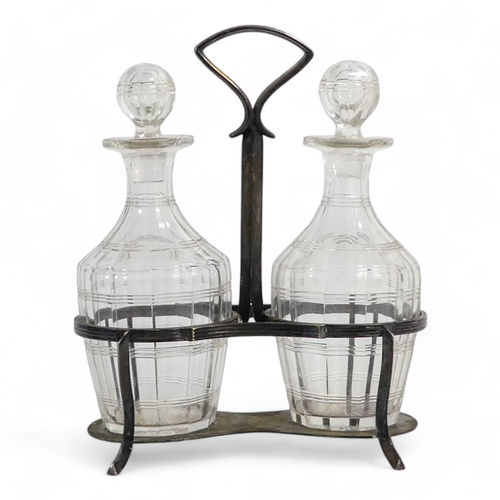 587 - An early 20th century silver plated oil and vinegar cruet - Asprey, with a pair of clear faceted gla... 