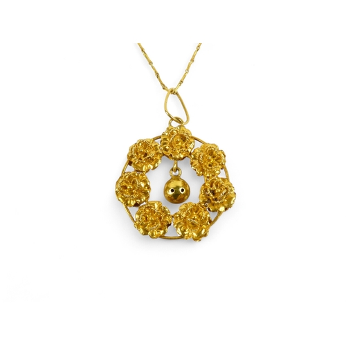 617 - A gilt wreath pendant and chain - probably high carat gold, formed from seven rose buds, on a fine l... 