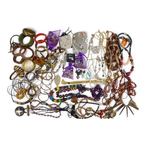 626 - A quantity of costume jewellery - including necklaces bangles and brooches.