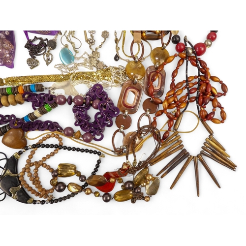 626 - A quantity of costume jewellery - including necklaces bangles and brooches.