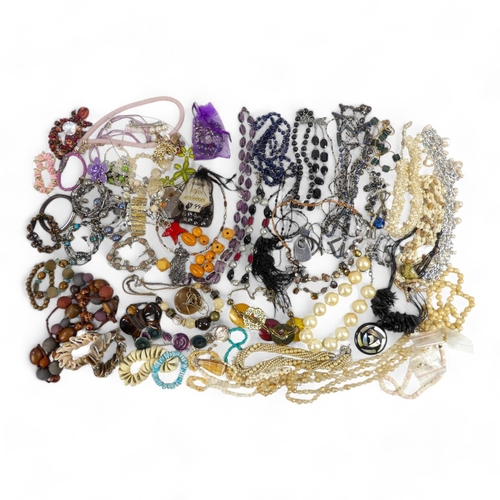 627 - A quantity of costume jewellery - including necklaces bangles and brooches.