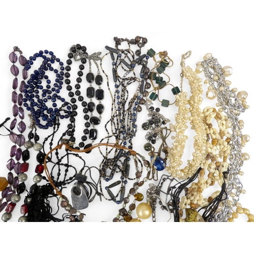 627 - A quantity of costume jewellery - including necklaces bangles and brooches.