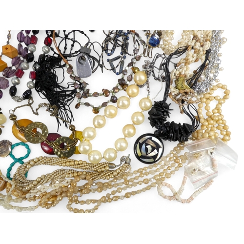 627 - A quantity of costume jewellery - including necklaces bangles and brooches.