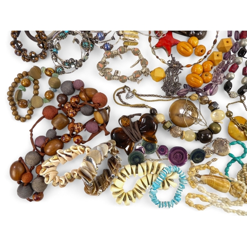 627 - A quantity of costume jewellery - including necklaces bangles and brooches.