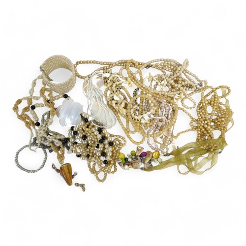 628 - A quantity of costume jewellery - including necklaces, bangles and brooches.