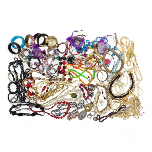 629 - A quantity of costume jewellery - including necklaces, bangles and brooches.