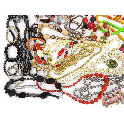 629 - A quantity of costume jewellery - including necklaces, bangles and brooches.