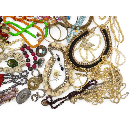 629 - A quantity of costume jewellery - including necklaces, bangles and brooches.