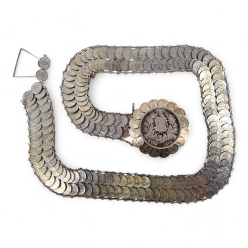 631 - A coin belt - formed from Guatemalan quarter reals, 186g.