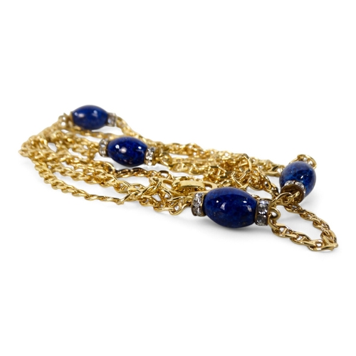 647 - A Christian Dior yellow metal necklace - set with blue and white stones, length 78cm, with branded b... 