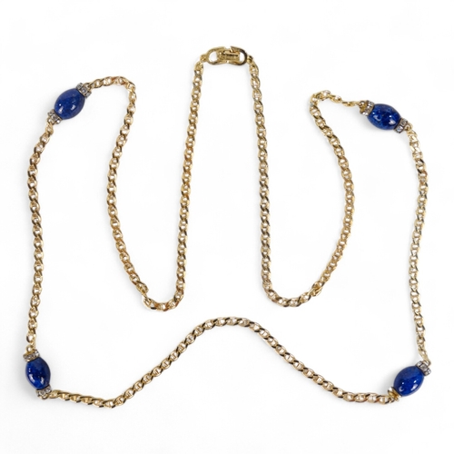 647 - A Christian Dior yellow metal necklace - set with blue and white stones, length 78cm, with branded b... 