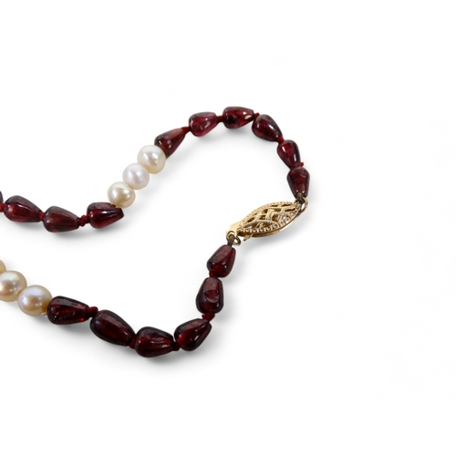 648 - A freshwater pearl and stone set necklace - with 14k gold clasp, length 68cm.