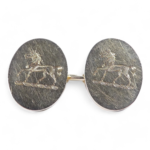 651 - A pair of 18ct gold cufflinks - boxed with a pair of shirt studs, the oval 'buttons' engraved with a... 