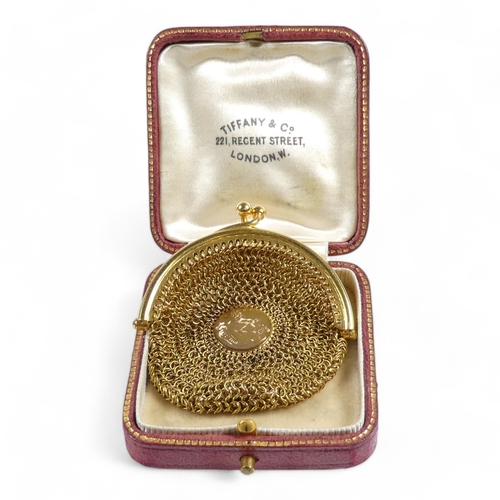 657 - A 15ct gold mesh sovereign purse - the clasp fitted with a suspension loop, the bag with a central d... 