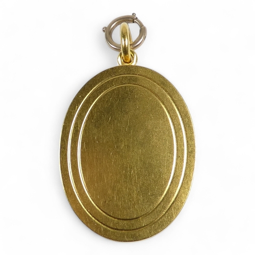 658 - A yellow metal and pearl set oval locket - foliate set with pearls, probably high carat gold, 21.6g.