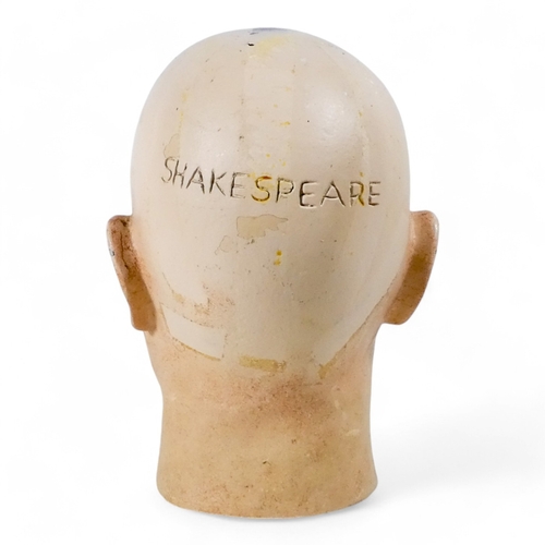 66 - An early 20th century mannequin head - with open eyes and emblazoned 'Shakespeare' to the rear, 27cm... 