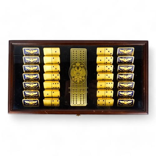 661 - A House of Faberge Imperial Dominoes set - crafted in 22ct gold plate and blue guilloche enamel, in ... 