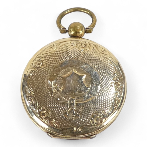 678 - A yellow metal locket - probably 9ct gold, circular with foliate engraving, 10.6g all in.