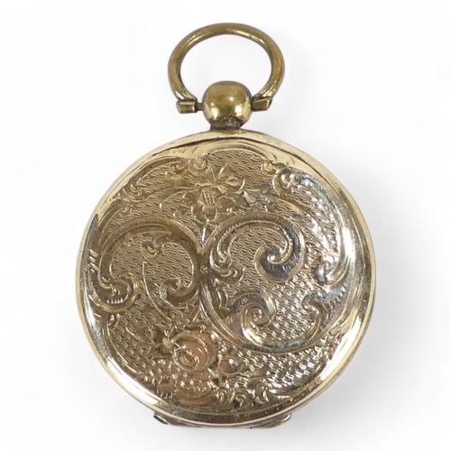 678 - A yellow metal locket - probably 9ct gold, circular with foliate engraving, 10.6g all in.