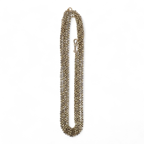 679 - A 9ct gold muff chain - of fancy box link, 157cm, 35g.