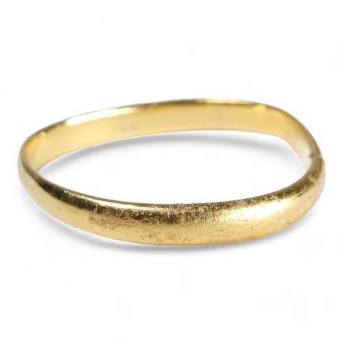 682 - A 22ct gold wedding band - size P (distorted), 2.4g.