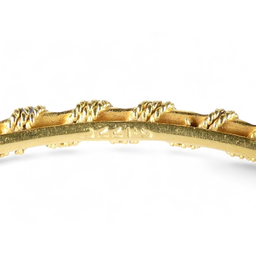 688 - A yellow metal bangle - spiral twist and stamped 22ct, 14g.