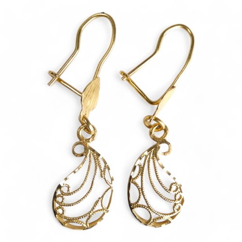 689 - A pair of yellow metal filigree earrings - of foliate form, stamped 21ct, together with another simi... 