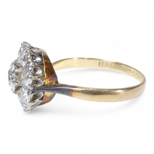 690 - An 18ct diamond cluster ring - with a central claw set stone, approx. 0.75ct, within a band of small... 