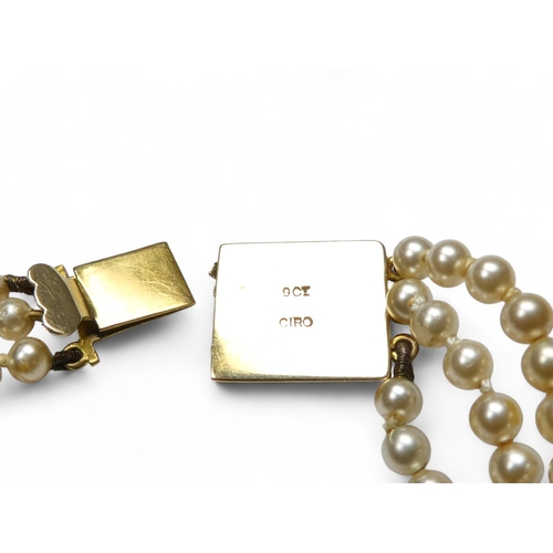 692 - A three string set of graduated pearls - with a 9ct gold clasp, 36cm long.