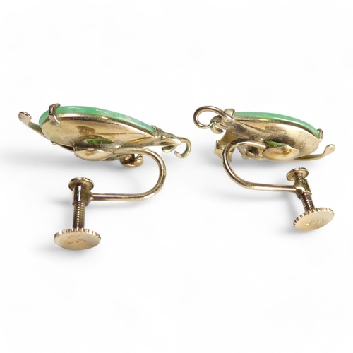 694 - A pair of 9ct gold jade set ear clips - of drop form with foliate setting, 4.9g.