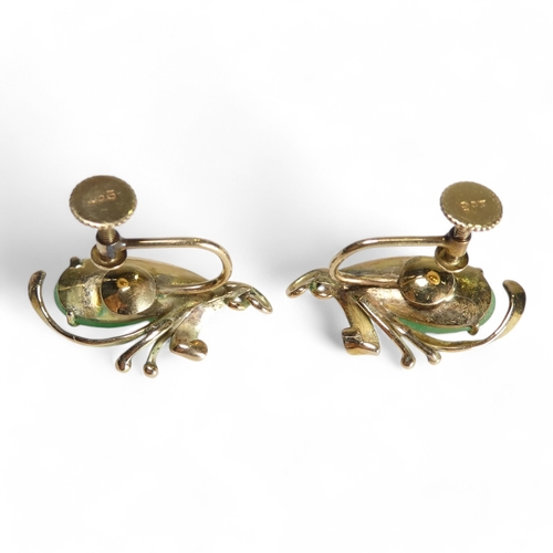 694 - A pair of 9ct gold jade set ear clips - of drop form with foliate setting, 4.9g.