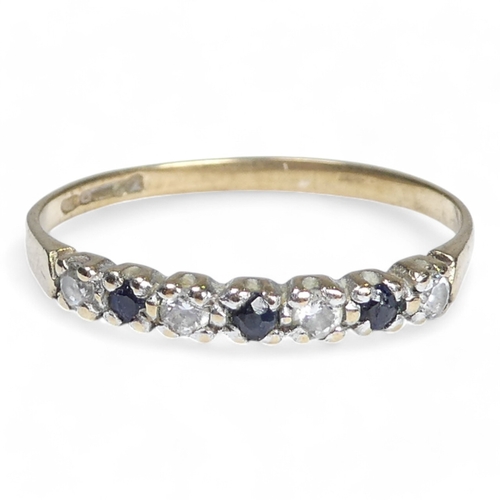 697 - A 9ct diamond and sapphire ring - set with alternating stones, size K, 1g.