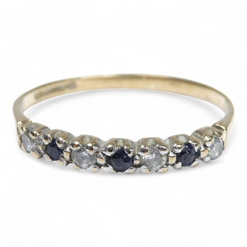 697 - A 9ct diamond and sapphire ring - set with alternating stones, size K, 1g.