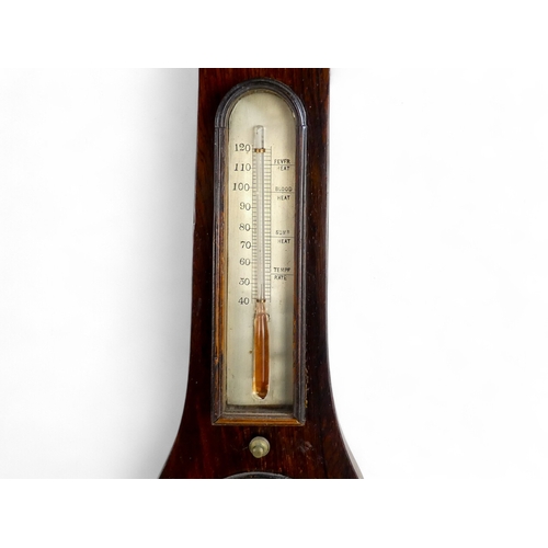 70 - A 19th century rosewood wheel barometer - incorporating hydrometer, thermometer and mirror.