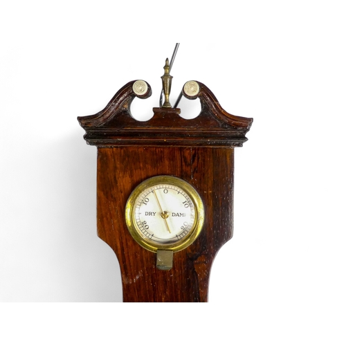 70 - A 19th century rosewood wheel barometer - incorporating hydrometer, thermometer and mirror.