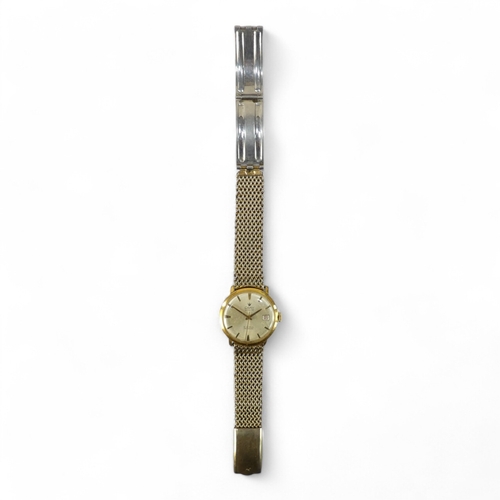 742 - A gentleman's wristwatch - the gilt watch head with cream dial set out in baton numerals with a date... 