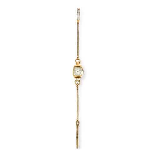 743 - A 9ct gold ladies cocktail watch - the cream dial set out in Arabic numerals, on a 9ct snake link go... 