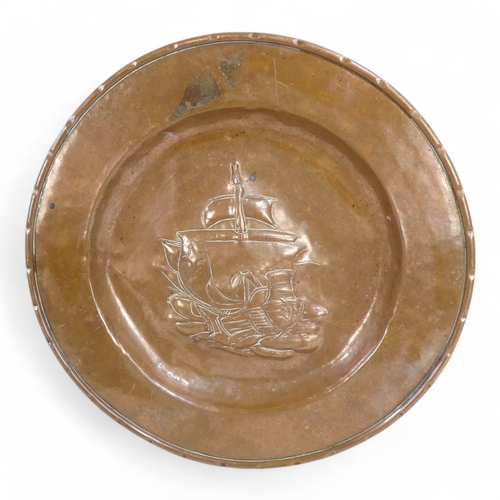 75 - An early 20th century Newlyn copper tray - of rectangular form, with a vacant cartouche and scallope... 