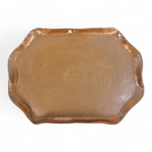 77 - An early 20th century Hayle copper tray - the centre decorated with an industrial scene, 43cm wide, ... 