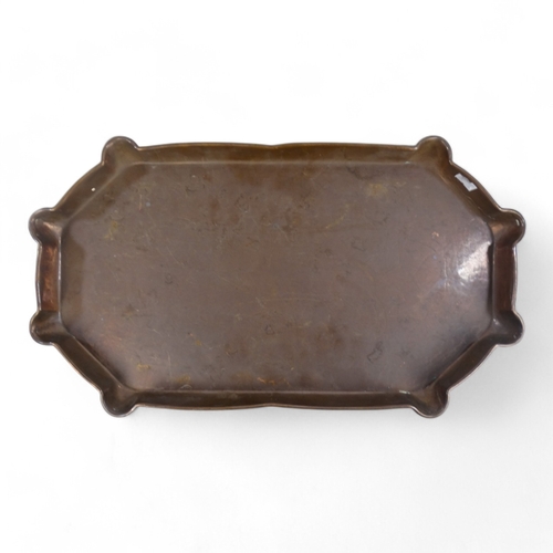 77 - An early 20th century Hayle copper tray - the centre decorated with an industrial scene, 43cm wide, ... 